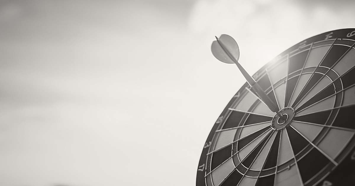 A dart hitting the bullseye on a dartboard